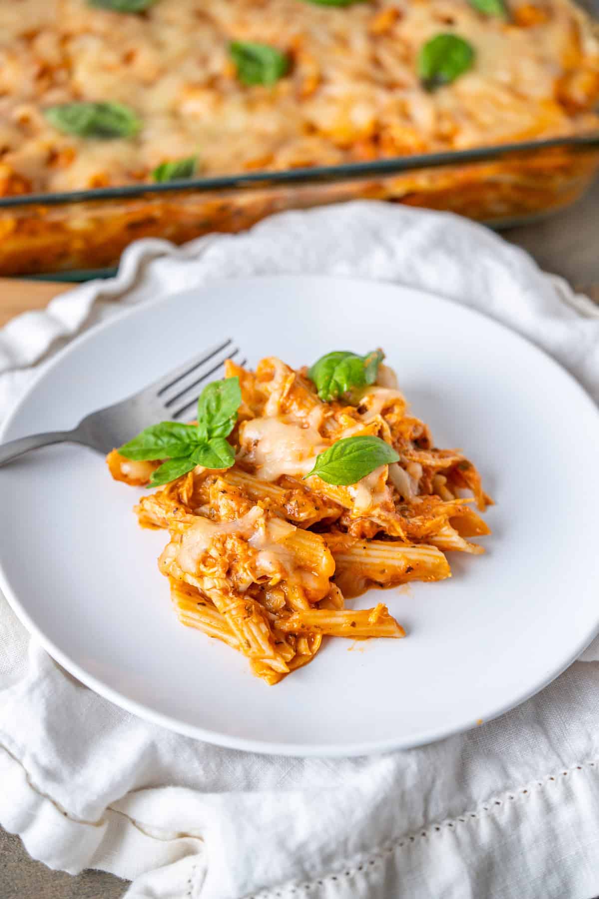 A serving of leftover turkey baked ziti on a plate.