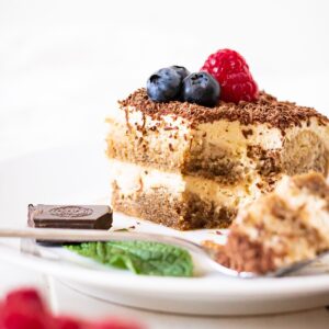 A piece of dairy-free tiramisu from the side to show the layers.