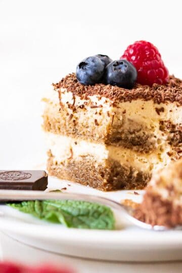 A piece of dairy-free tiramisu from the side to show the layers.