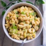 Creamy vegan broccoli mac and cheese in a serving bowl.