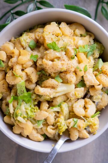 Creamy vegan broccoli mac and cheese in a serving bowl.