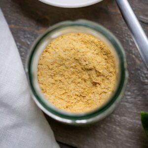 A jar of nut-free vegan parmesan cheese.