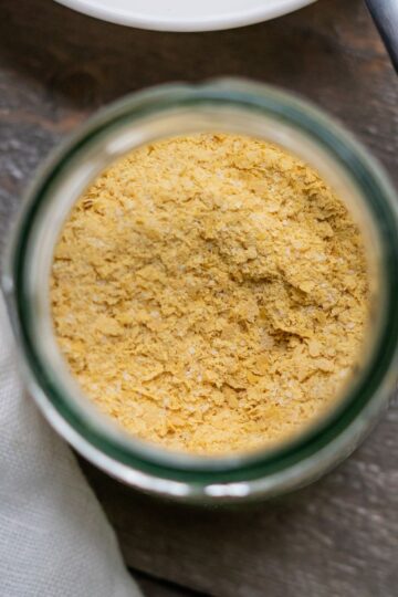 A jar of nut-free vegan parmesan cheese.