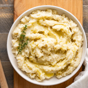 A serving dish of creamy dairy-free mashed potatoes with coconut milk.